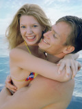 Couple Hugging at Beach Photographic Print