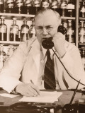 Mature Doctor Talking on Telephone Photographic Print