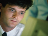 Man Looking at Computer Screen Photographic Print