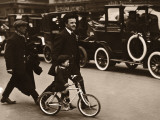 Father Guiding Son (3-5) on Bicycle Across Street Photographic Print