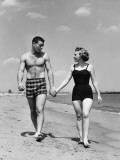 Young Couple Walking on Beach Photographic Print