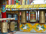 Tibetan Buddhist Prayer Wheels at Shuzheng Village, Sichuan Province, China Photographic Print by Charles Crust
