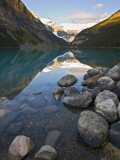 Rocky Mountains and Boulders Reflected in Lake Louise, Banff National Park, Alberta, Canada Photographic Print by Larry Ditto