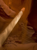 Sunbeam Penetrates Dusty Air of Canyon, Lower Antelope Canyon, Arizona, USA Photographic Print by Cathy & Gordon Illg