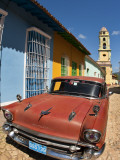Old Classic Chevy on Cobblestone Street of Trinidad, Cuba Photographic Print by Bill Bachmann
