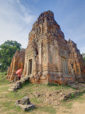 Tourist With Umbrella Views Part of Lolei Temple, Angkor Wat, Cambodia Photographic Print by  Jones-Shimlock
