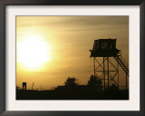 Camp Warhorse Guard Tower at Sunset Posters by Stocktrek Images 