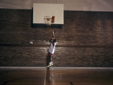 Young Boy Practicing his Basketball Shooting Photographic Print
