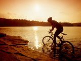 Silhouette of Mountain Biker at Sunset Photographic Print