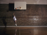 Young Boy Practicing his Basketball Shooting Photographic Print