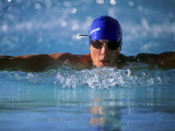 Male Swimmers Performing the Butterfly Photographic Print