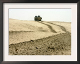 An Amphibious Assault Vehicle Rolls Through a Desert Field North of Fallujah Poster by Stocktrek Images 