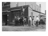 Firefighter Jumps Into Net Held By Fellow Firemen Posters