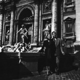 Martine Carol with Christian-Jaque standing by the Trevi Fountain in Rome Photographic Print by Benno Graziani