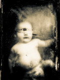 Sepia Photograph of Infant Cyclops Photographic Print by Clive Nolan