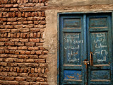 Blue Door with Arabic Writing, Luxor Town, Egypt Photographic Print by Clive Nolan