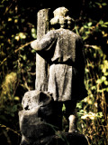 Statue of a Young Boy in Cemetery Photographic Print by Clive Nolan