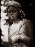 A Female Statue in Cemetery Photographic Print by Clive Nolan