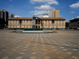 Statue of Jomo Kenyatta with a Courthouse in the Background, Nairobi Law Courts, Nairobi, Kenya Photographic Print