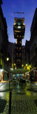 Odd Shaped Building Lit Up in a Narrow Street, Carmo Lift, Lisbon, Portugal Photographic Print