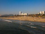 Tourists on Beach with Buildings in the Background, Ocean Avenue, Santa Monica Photographic Print