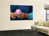 Woman in Blue Dress Holding Pink Lotus Flower Wall Mural by Antony Giblin