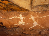 Libya, Fezzan, Jebel Akakus; a Pair of Running Figures Painted onto the Walls of Uan Muhuggiag Photographic Print by Amar Grover