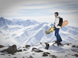 A Snowboarder at the Summit of Mount Affawat in Gulmarg, Kashmir, India Photographic Print by Julian Love