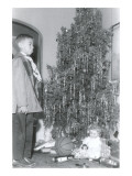 Boy Sticking out Lower Lip at Christmas Tree Posters