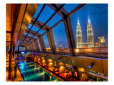 The Sky Bar in Kuala Lumpur with a view of Petronas Premium Photographic Print by Trey Ratcliff