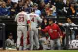 Cardinals v Brewers - Milwaukee, WI - Oct. 16: David Freese, Yadier Molina and Rafael Furcal Photographic Print by Jonathan Daniel