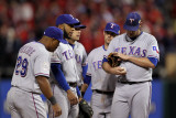 Texas Rangers v St Louis Cardinals, St Louis, MO - Oct. 27: Colby Lewis and Ron Washington Photographic Print by Ezra Shaw