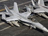 A US Navy F/A-18C Hornet Parked on the Flight Deck of USS Nimitz Photographic Print by  Stocktrek Images