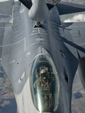 A U.S. Air Force F-16C Fighting Falcon Receives In-Flight Refueling Photographic Print by  Stocktrek Images
