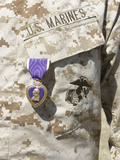 The Purple Heart Award Hangs over the Heart of a U.S. Marine Photographic Print by  Stocktrek Images