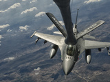 A U.S. Air Force F-16C Block 50 Fighting Falcon Receives In-Flight Refueling Photographic Print by  Stocktrek Images