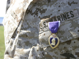 The Purple Heart Award Hangs over the Heart of a U.S. Marine Photographic Print by  Stocktrek Images