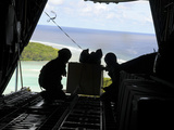 Airmen Push Out a Pallet of Donated Goods from a C-130 Hercules Lámina fotográfica por Stocktrek Images