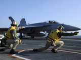 Shooters Aboard the USS George H.W. Bush Give the Go-Ahead Signal to Launch an F/A-18 Super Hornet Photographic Print by  Stocktrek Images
