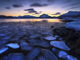 Ice Flakes Drifting Against the Sunset in Tjeldsundet Strait, Troms County, Norway Photographic Print by  Stocktrek Images