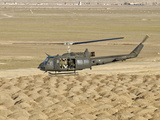 Italian Army AB-205MEP Utility Helicopter in Flight over Shindand, Afghanistan Lámina fotográfica por Stocktrek Images