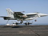 A US Navy F/A-18E Super Hornet Prepares to Land Aboard USS Eisenhower Photographic Print by  Stocktrek Images