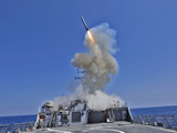 USS Barry Launches a Tomahawk Cruise Missile Photographic Print by  Stocktrek Images