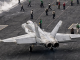 A US Navy F/A-18C Hornet on the Flight Deck of Aircraft Carrier USS Eisenhower Photographic Print by  Stocktrek Images