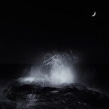 The Crescent Moon and Waves Splashing over Rocks in Miramar, Argentina Photographic Print by  Stocktrek Images