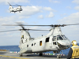 A CH-46E Sea Knight Helicopter Takes Off from the Flight Deck of USS Essex Photographic Print by  Stocktrek Images