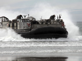 U.S. Navy Landing Craft Air Cushion Makes a Beach Landing Photographic Print by  Stocktrek Images