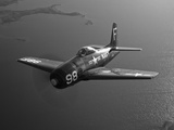 A Grumman F8F Bearcat in Flight Photographic Print by  Stocktrek Images