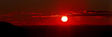 A Panoramic Image Where Clouds Mimic Solar Prominences Photographic Print by  Stocktrek Images