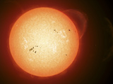 Illustration of the Sun with Visible Dark Sunspots on the Surface, Prominences and Some Solar Wind Photographic Print by  Stocktrek Images